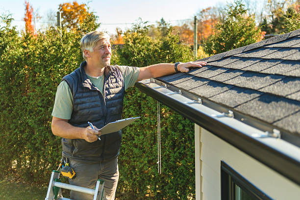 Professional Roofing technician working in Collins, MO